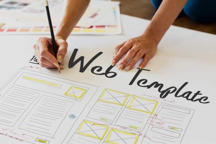 A designer works on the wireframe of a web template