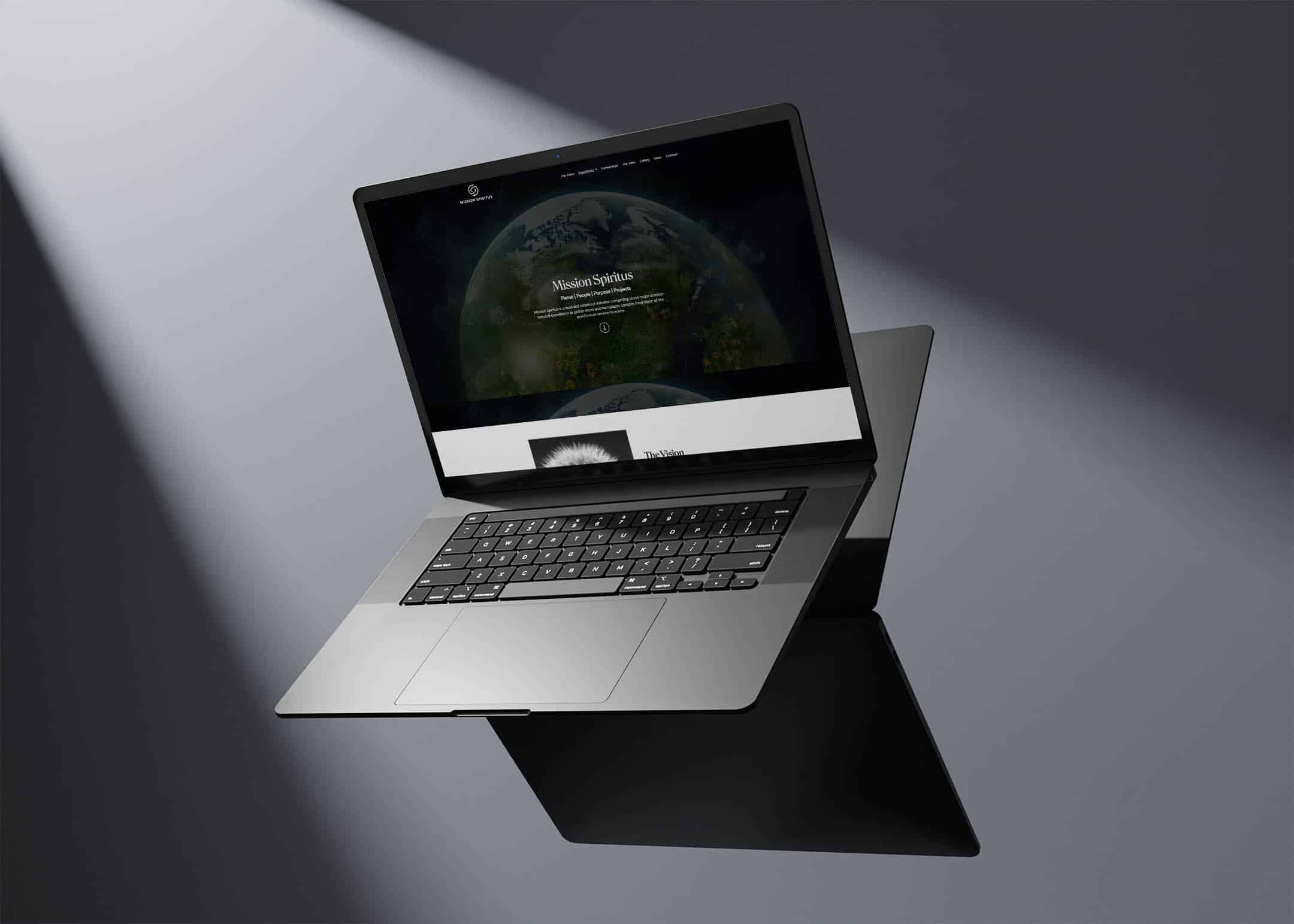 The Mission Spiritus homepage displayed on a laptop